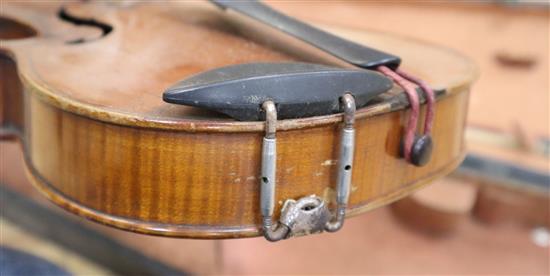 A ate 19th century German violin labelled Heinrich Schwartz Leipzig 1894 cased with a bow